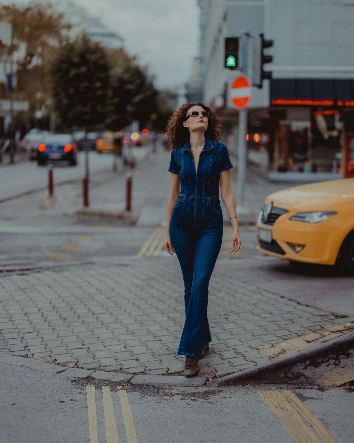 Woman styling white jeans in daylight