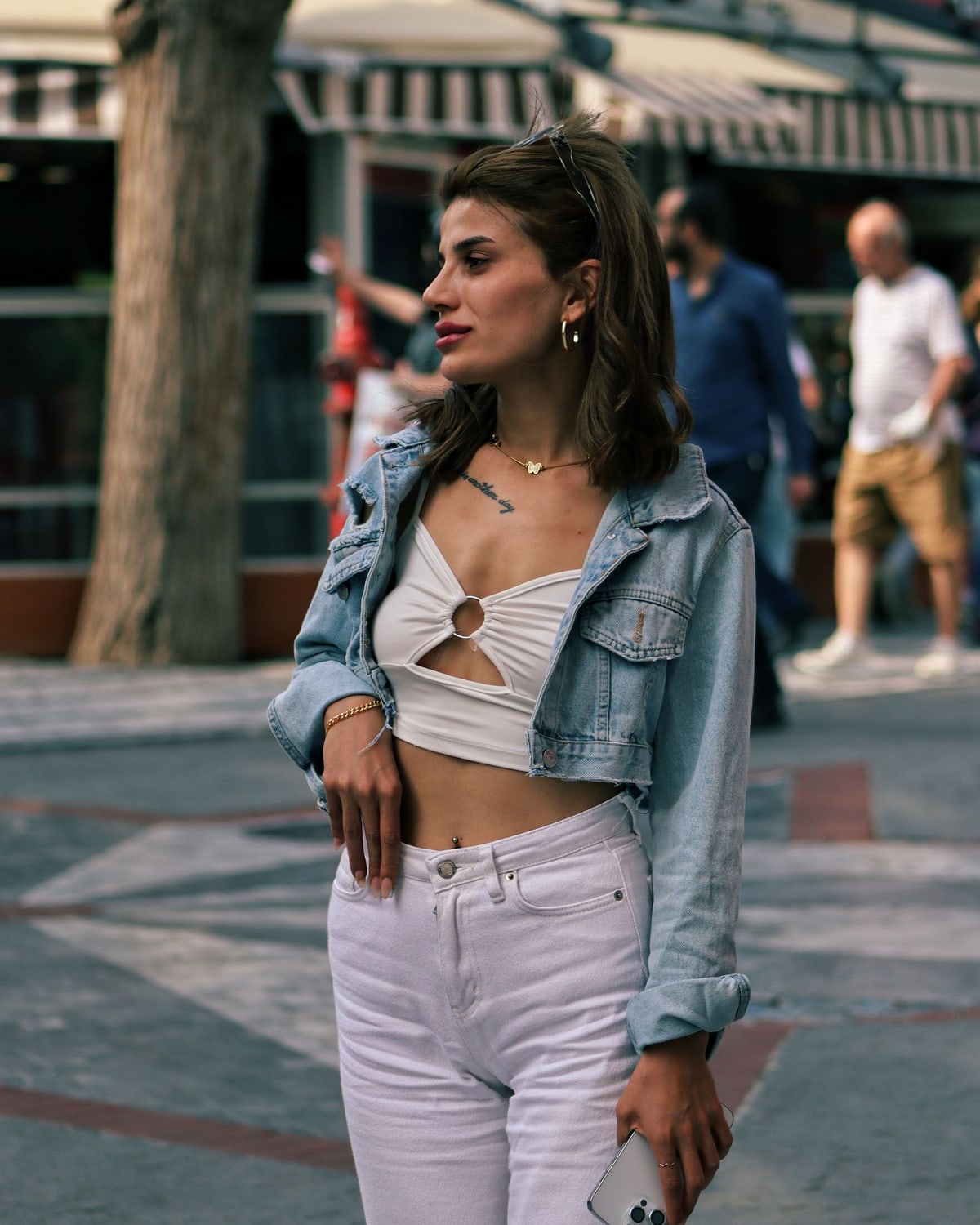 Woman wearing a denim jacket on the street