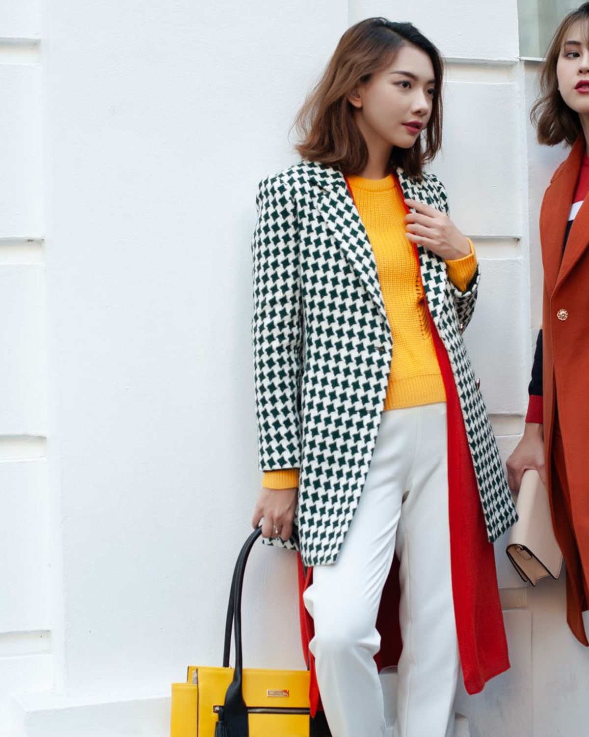 Woman styling a leather jacket